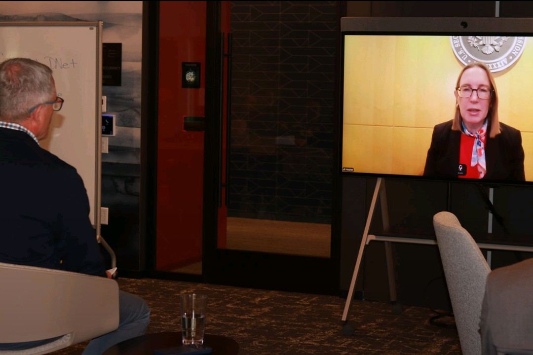 Hester Peirce speaking by video at a Deloitte event in Boston